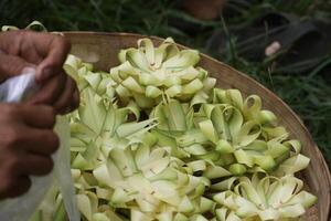 making floral offers to the gods, bali photo