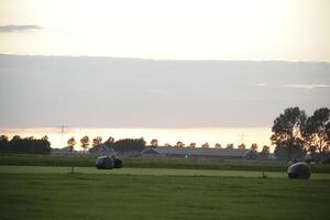 sunset in the netherlands, clouds, colors photo