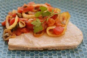 tuna with tomato sauce and capers photo