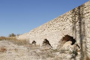 roman aqueduct in antas, spain photo