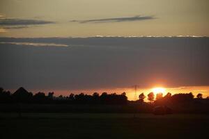 sunset in the netherlands, clouds, colors photo