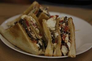 greek sandwich with feta cheese, tomato, olives, bell pepper photo