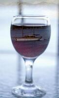 sailing boat in wine glass photo