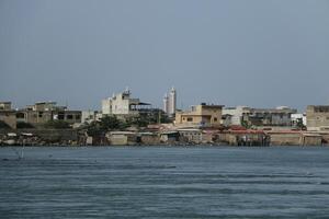 river and view on houses at the shore in Cotonou, Benin photo