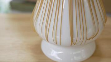 Extreme Close up and Tilt up Slow Motion Footage of Bamboo Whisk Prepare for Tea Ceremony video