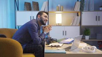 Young man dreaming of career at home. video