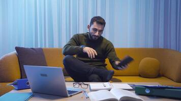Man taking a break is using a phone. video