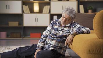 Thoughtful man sitting on the floor. video