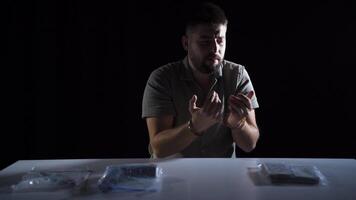 Crime tools, handcuffed criminal explains. video