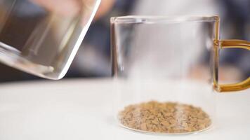 Dissolving coffee in coffee cup close-up. video