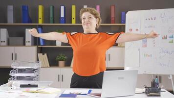 Businesswoman exercising in the office. video