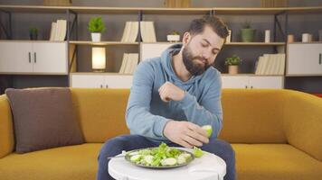 Happy man eating fruit is on diet. video