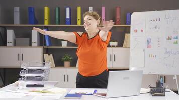 Businesswoman exercising in the office. video