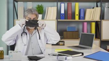 Doctor wearing mask smiling. video