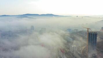A building under construction made of monolithic concrete shrouded in fog video