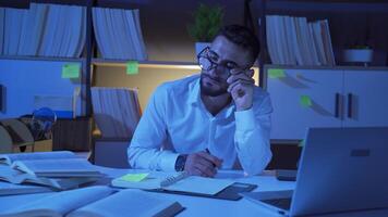 Male researcher working at his desk. video