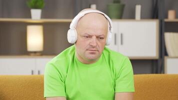 Depressed man listens to music. video