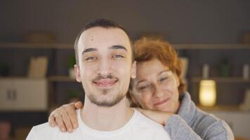 Mother hugging her son. video