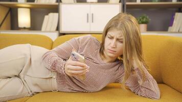 Young woman crying at news she received video