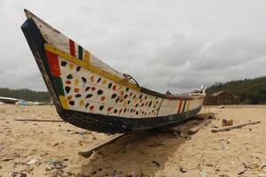 fishing boat at the beach at porto novo photo