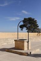 water well at the castle of alicante, spain photo