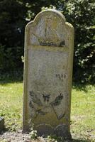 ancient graveyard in westerland, the netherlands photo