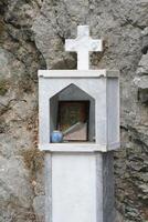 Greek houses, memorial to a deceased person photo