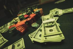 Poker chips are stacked on a green textured table smoke of cigars fills the room photo