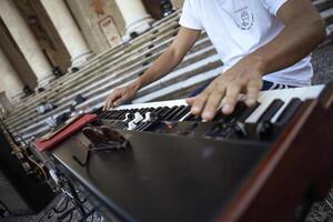 Fratta Polesine Italy 10 December 2023 A close up of a keyboardist s hands expertly playing during a live concert in daylight photo