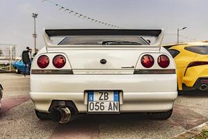 Vicenza Italy 19 March 2024 Captivating rear view of a parked Nissan Skyline symbolizing speed and style photo