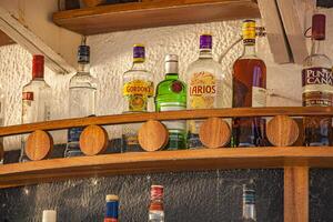 DOMINICUS DOMINICAN REPUBLIC 6 FEBRAURY 2020 Bottles of alcohol on the bar shelf photo