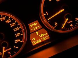 Vibrant Red Backlit Car Dashboard photo