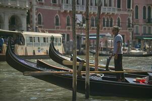 VENICE ITALY 25 MARCH 2019 Gondola in Venice with people on board photo