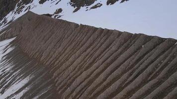 Closeup view of sand pile with mountain in the backdrop video