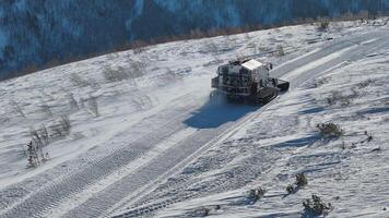 Snowcat clears snow for ski paths resort preparation Resort preparation ensuring perfect skiing conditions. Resort preparation machine snowy nature Silence of north snow trail readies for adventure. video