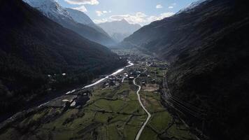 an aerial view of a mountain valley with a river running through it video