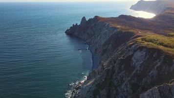 An ocean view from a cliff, overlooking water, sky, and natural landscape video