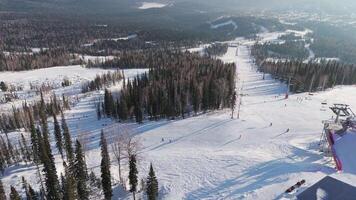 Ski resort aerial view winter vacation snowy wilderness Winter vacation surrounded by winter forest serene beauty. Winter vacation where cold meets majestic nature perfect snowy retreat. video