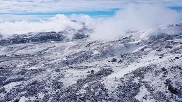 Aerial view of frozen lava fields on the slopes of an extinct volcano in summer video