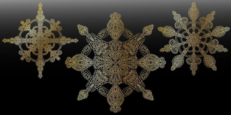 three snowflakes in gold and silver on a black background