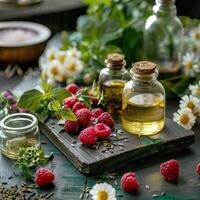 Still life of raspberry essential oil with fresh raspberries and chamomile flowers on a wooden table photo