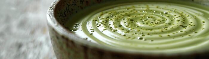 A close up image of a bowl of matcha tea. photo