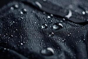 Black waterproof fabric with water drops photo