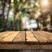 An empty wooden table with a blurred background of a restaurant patio with string lights. photo