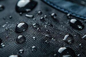 Black fabric with water drops photo