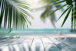A wooden table on a tropical beach with palm trees and blue water. photo