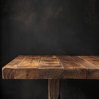 Rustic wooden table against a dark background photo