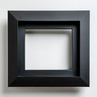A black wooden picture frame with a white background. photo