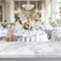 marble table with a blurred background of a wedding reception. photo