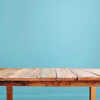 closeup of a rustic wooden table against a blue background photo